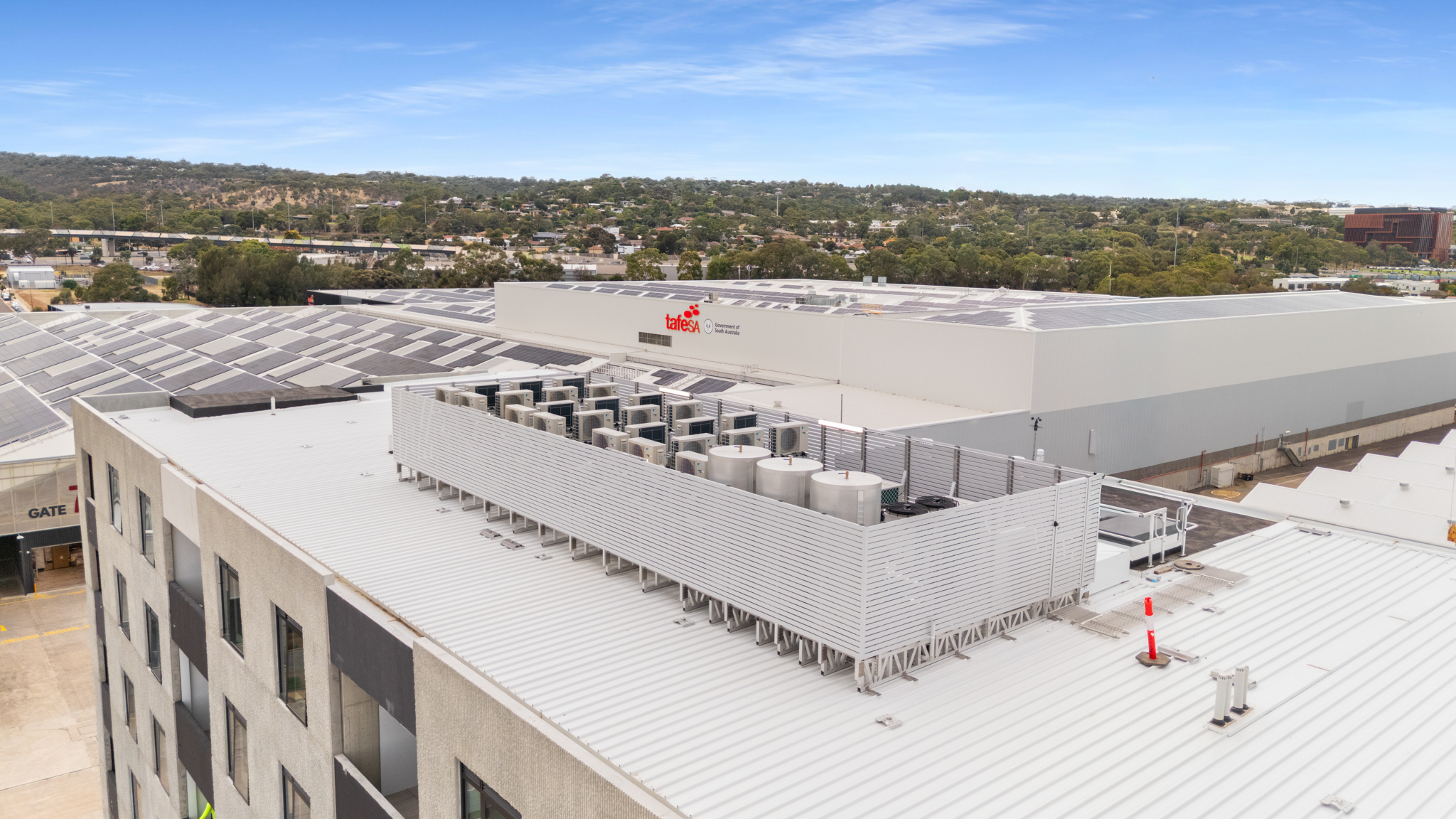 Roof mount HVAC plaform with slatted HVAC screen on apartment building - Tonsley, SA