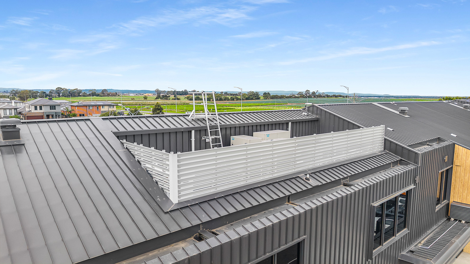 HVAC plant platforms and supermarket deck with acoustic screens at shopping centre in Ramlegh, VIC