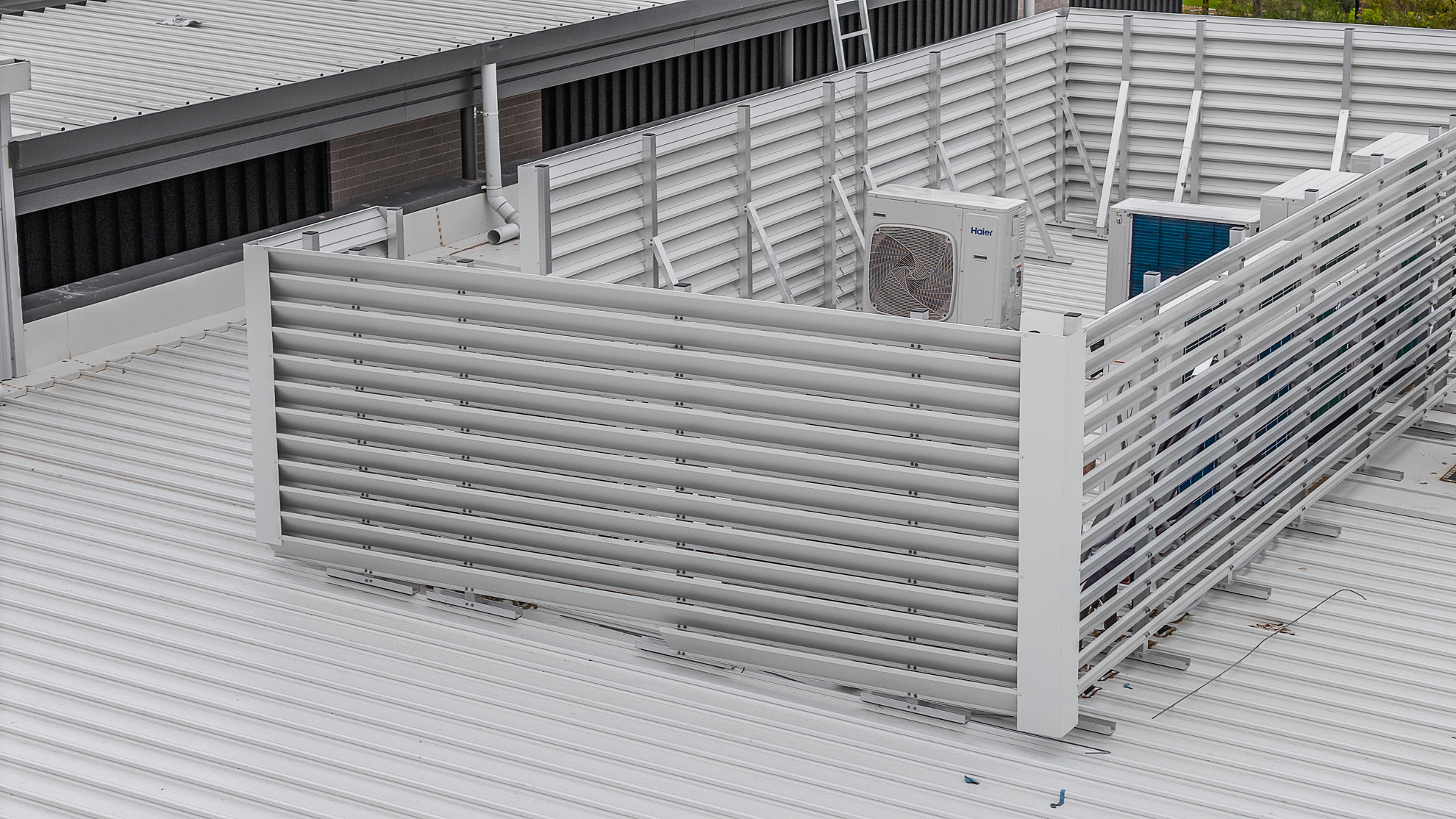 HVAC plant platforms and supermarket deck with louvre screens at shopping centre in Ramlegh, VIC