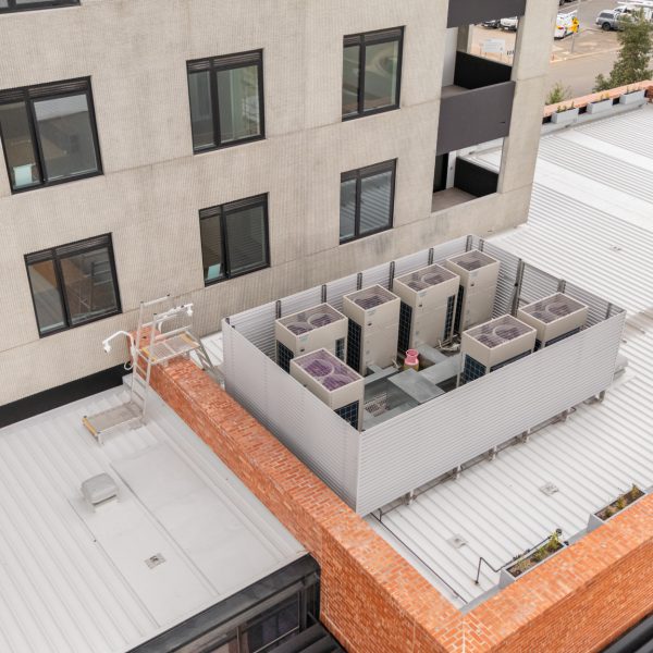 Roof mount HVAC plaform with slatted HVAC screen on apartment building - Tonsley, SA